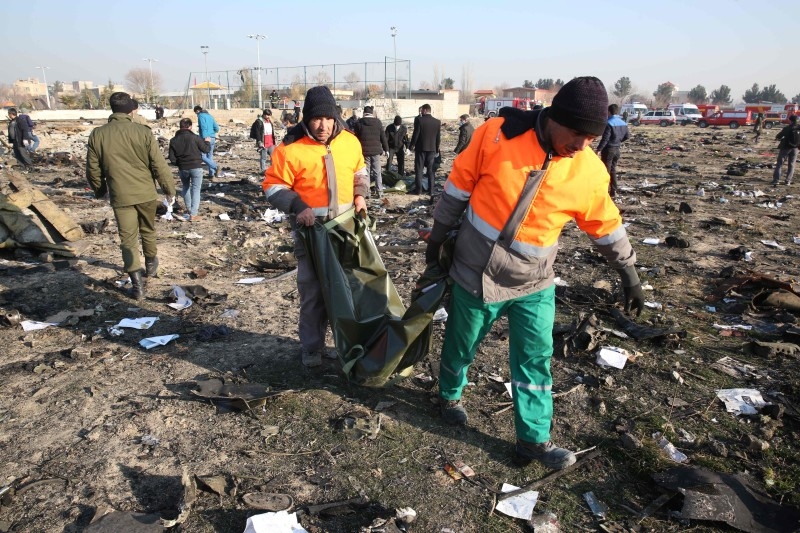 Rescue teams work at the scene after a Ukrainian plane carrying 176 passengers crashed near Imam Khomeini airport in the Iranian capital Tehran early on Wednesday morning, killing everyone on board. -AFP