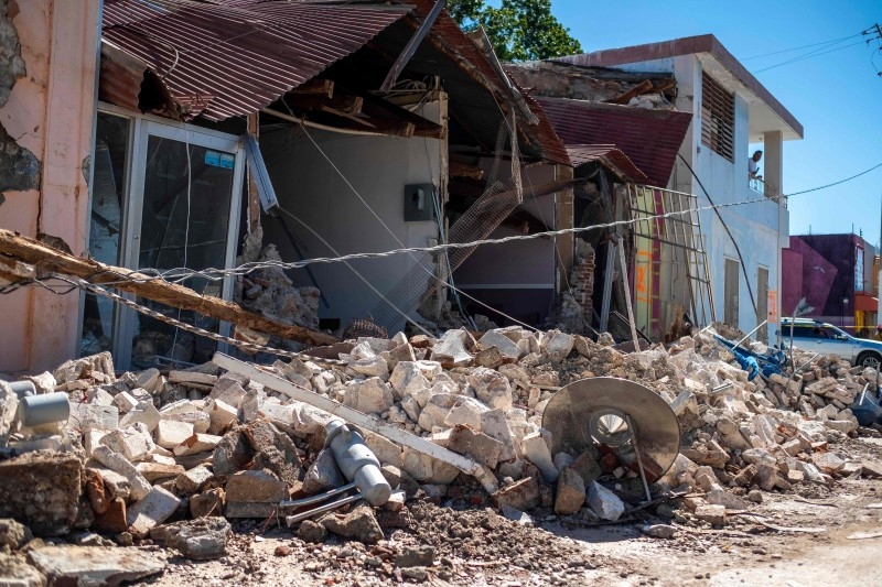 A collapsed business is seen after an earthquake hit the island in Guanica, Puerto Rico on Tuesday. -AFP