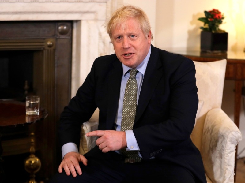 Britain's Prime Minister Boris Johnson gestures as he interacts with European Commission President Ursula von der Leyen inside 10 Downing Street in central London on Wednesday ahead of their meeting. The EU's top official on Wednesday predicted 