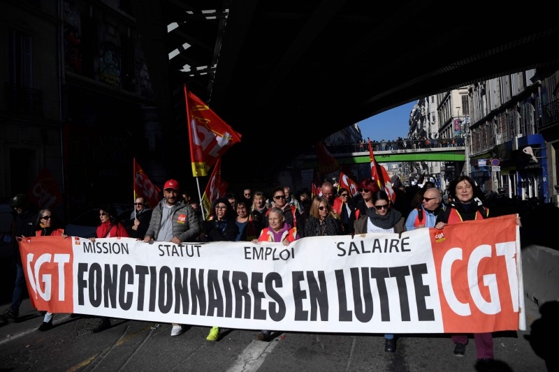 Protestors take part in a demonstration against the pension reform in Marseille, on Thursday.  French President's push for sweeping changes to the pension system has unleashed the longest transport strike in France in decades, causing weeks of travel chaos in Paris particularly. — AFP