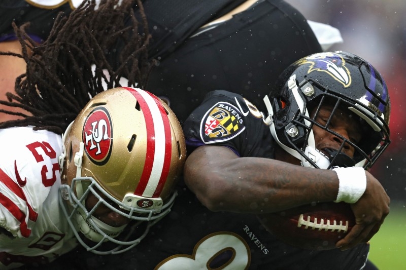 In this file photo taken on Dec. 3, 2019 Quarterback Lamar Jackson No. 8 of the Baltimore Ravens rushes against the San Francisco 49ers at M&T Bank Stadium in Baltimore, Maryland. NFL playoff top seeds Baltimore and San Francisco entertain bottom-seeded upstarts in this weekend's conference semifinal showdowns, providing a supreme test for clubs who have already toppled expected winners. — AFP