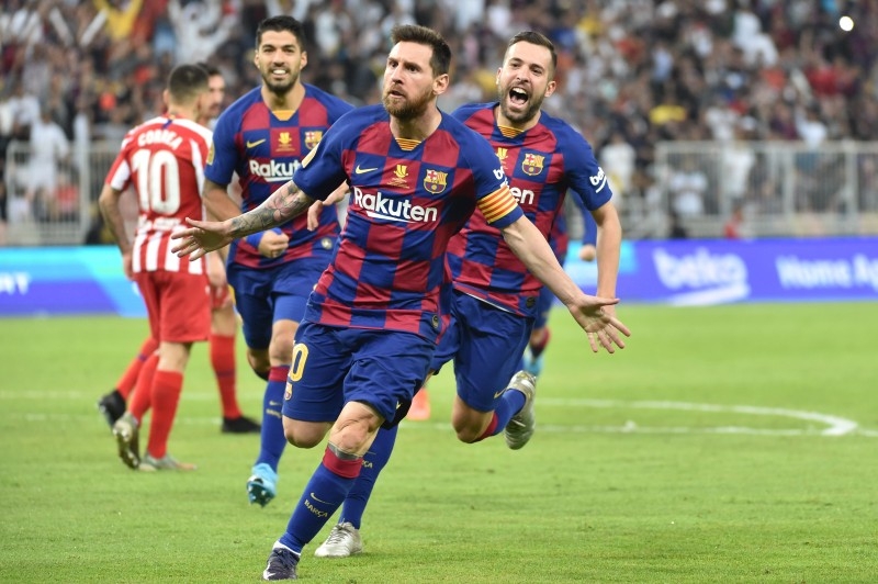 Barcelona's Argentine forward Lionel Messi (C) celebrates his goal during the Spanish Super Cup semifinal between Barcelona and Atletico Madrid on Thursday, at the King Abdullah Sport City in the Saudi Arabian port city of Jeddah. — AFP