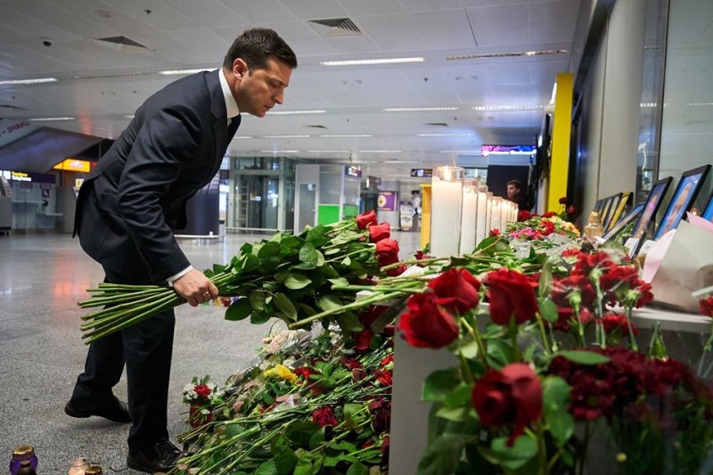 This handout picture taken and released by the Ukrainian presidential press service shows Ukraine's President Volodymyr Zelensky placing flowers at a memorial for the victims of the Ukraine International Airlines Boeing 737-800 crash in the Iranian capital Tehran, at the Boryspil airport outside Kiev on Thursday.  — AFP