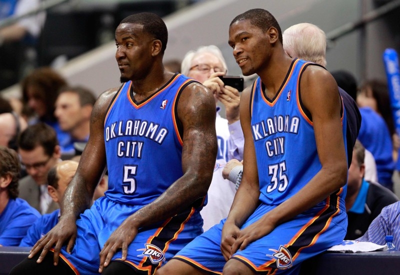 In this file photo taken on May 18, 2011 Kendrick Perkins No. 5 and Kevin Durant No. 35 of the Oklahoma City Thunder wait to enter the game in the third quarter while taking on the Dallas Mavericks in Game Two of the Western Conference Finals during the 2011 NBA Playoffs at American Airlines Center in Dallas, Texas. — AFP