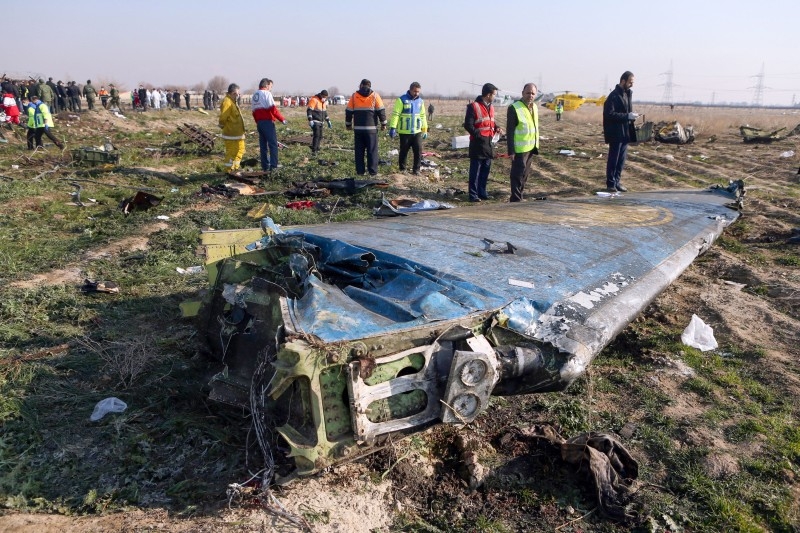  In this file photo taken on January 8, 2020 rescue teams are seen at the scene of a Ukrainian airliner that crashed shortly after take-off near Imam Khomeini airport in the Iranian capital Tehran.-AFP