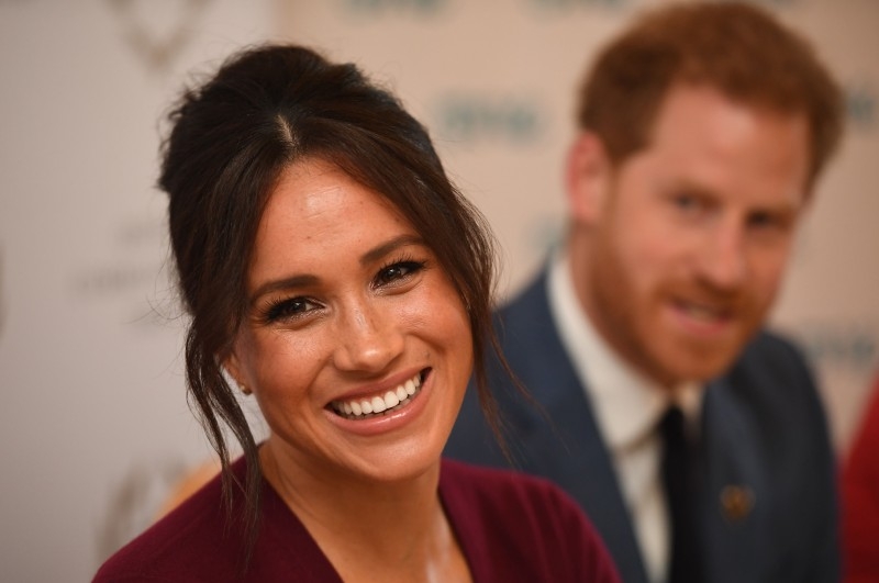  In this file photo taken on October 25, 2019 Britain's Prince Harry, Duke of Sussex (R) and Meghan, Duchess of Sussex attend a roundtable discussion on gender equality with The Queen’s Commonwealth Trust (QCT) and One Young World at Windsor Castle in Windsor.  -AFP