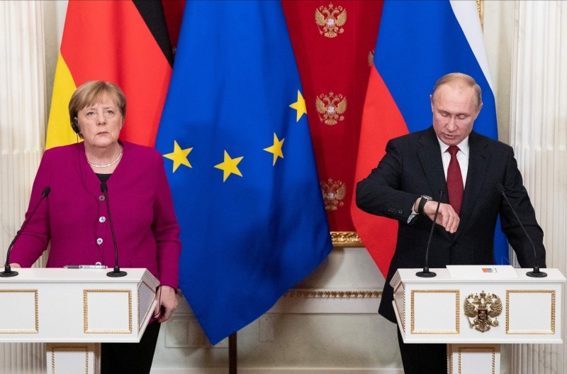 Russia's President Vladimir Putin, right, and Germany's Chancellor Angela Merkel attend their joint press conference after their meeting at the Kremlin in Moscow on Saturday. — AFP