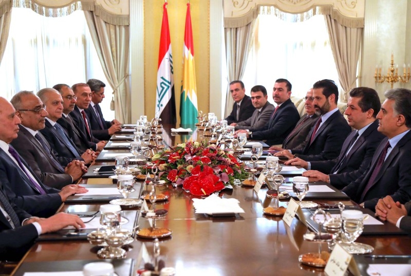 Prime Minister of the Iraqi Kurdish Regional Government (IKRG) Masrour Barzani, second left, meets with Iraq's caretaker Prime Minister Adel Abdel Mahdi, second right, in Irbil, the capital of the northern Iraqi Kurdish autonomous region, on Saturday. — AFP