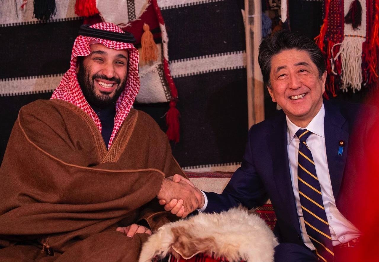 Crown Prince Muhammad Bin Salman, deputy premier and minister of defense, and Japan's Prime Minister Shinzo Abe shake hands during their meeting in Al-Ula on Sunday. — SPA
