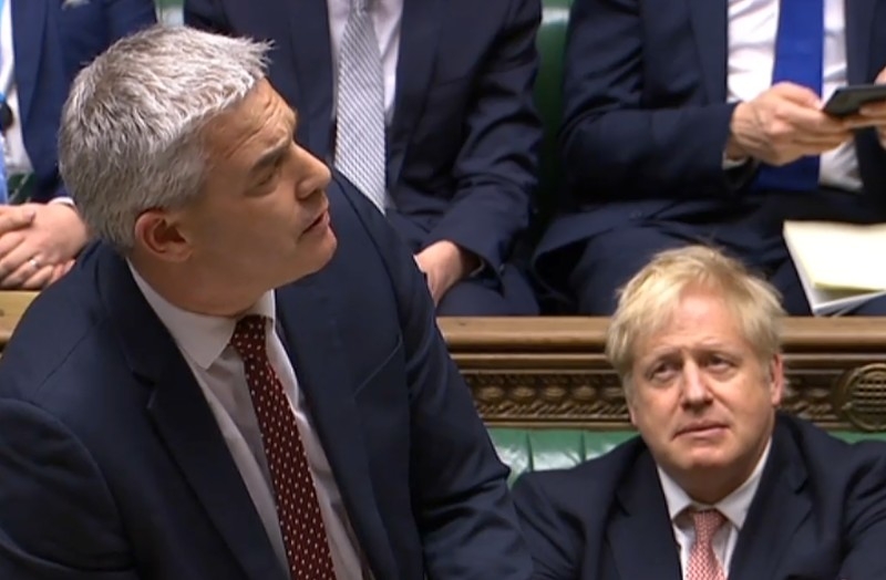 A video grab from footage broadcast by the UK Parliament's Parliamentary Recording Unit (PRU) shows Britain's Prime Minister Boris Johnson (R) reacting as Britain's Secretary of State for Exiting the European Union (Brexit Minister) Stephen Barclay speaking during the conclusion of proceedings of the European Union (Withdrawal Agreement) Bill, in the House of Commons in London on Jan. 9, 2020. — AFP