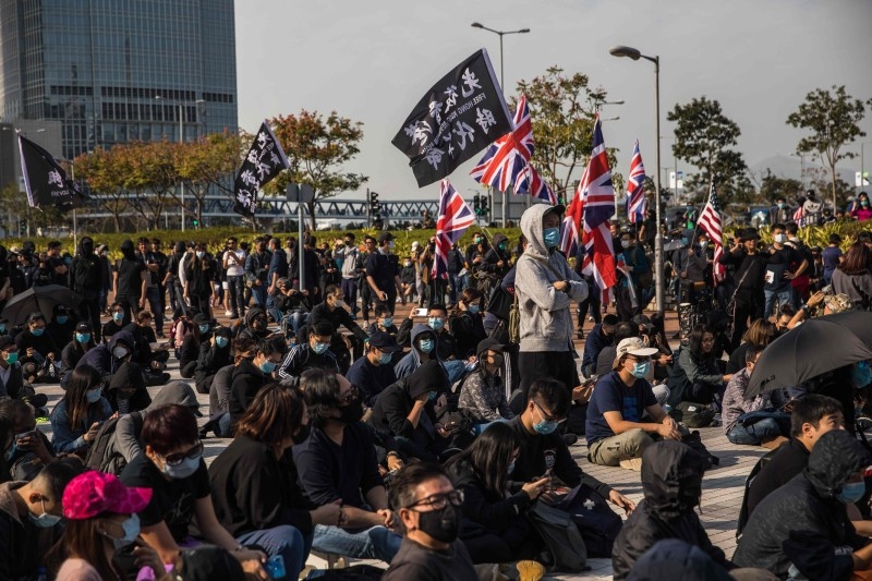 Pro-democracy protesters attend a rally at Edinburgh Place in the Central district of Hong Kong on Sunday. Hong Kong has been battered by protests for seven months, which from time to time fell into violent clashes between protesters and riot police. — AFP