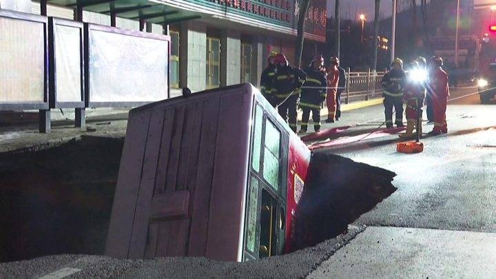 The sinkhole opened up at a bus stop in Xining, north west China. -Courtesy photo