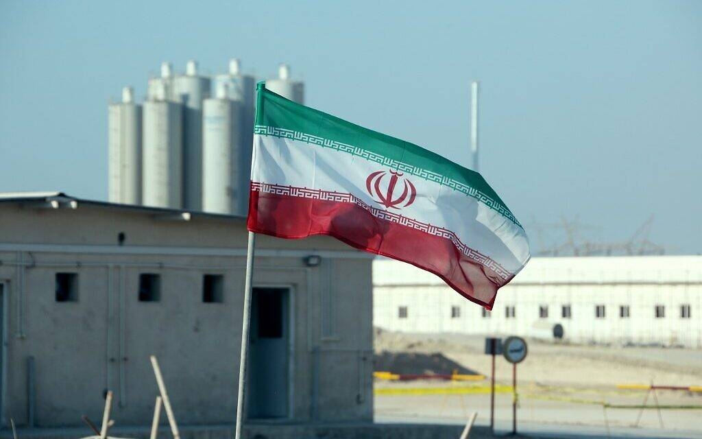An Iranian flag flutters in Iran's Bushehr nuclear power plant during an official ceremony to kick-start works on a second reactor at the facility in this Nov. 10, 2019 file photo. — AFP