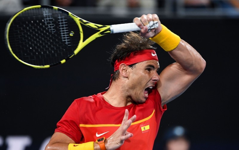 Rafael Nadal of Spain hits a return against Novak Djokovic of Serbia in their men's singles match in the final of the ATP Cup tennis tournament in Sydney on Jan. 12, 2020.  — AFP