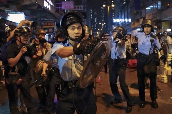 Hong Kong police at pro-democracy protests. -AFP