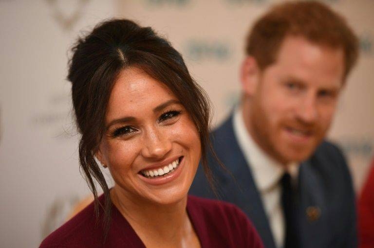 Britain's Prince Harry and his wife Meghan began a new life Sunday as somewhat ordinary people with financial worries and security concerns after being stripped of their royal titles and public funding by the Queen.