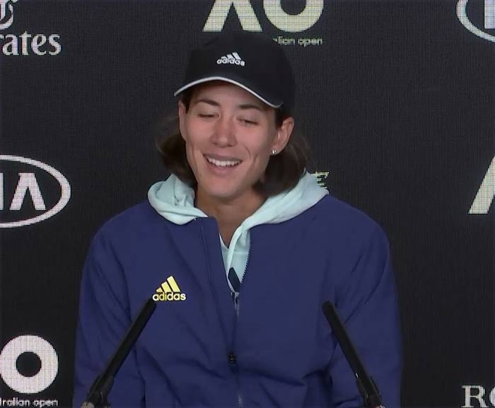 Two-time Grand Slam champion Garbine Muguruza climbed Mount Kilimanjaro to help clear her mind of tennis and the unusual off-season preparation is paying off after she reached round three at the Australian Open on Thursday. She is seen at the press conference after her win.