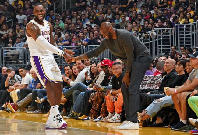 LeBron James, left, is on the verge of overtaking Kobe Bryant, right, for third on the NBA's all-time scoring list, another massive achievement for the 35-year-old Los Angeles Lakers superstar forward. The two are seen shaking hands in a file photo.