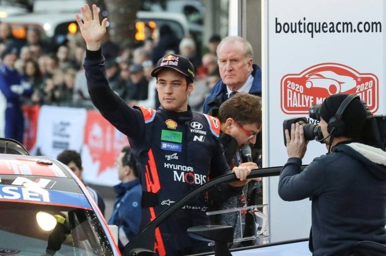 Belgium's Thierry Neuville waves at the departure line for the start of the 88th Rally of Monte Carlo. — AFP