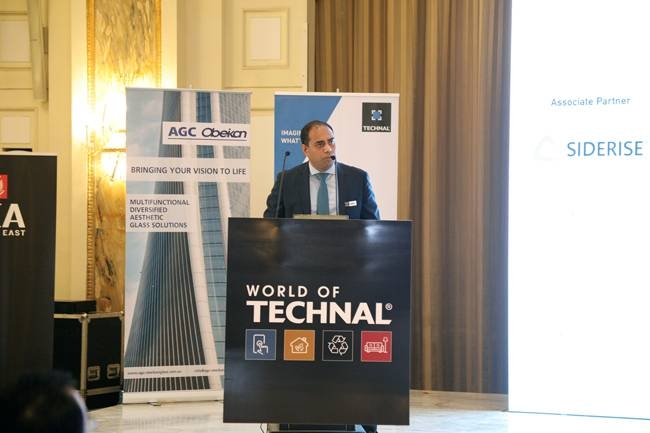 Sam-Robinson, MD, Hydro Building Systems Middle East speaking at a conference where industry leaders from the building and construction sector.