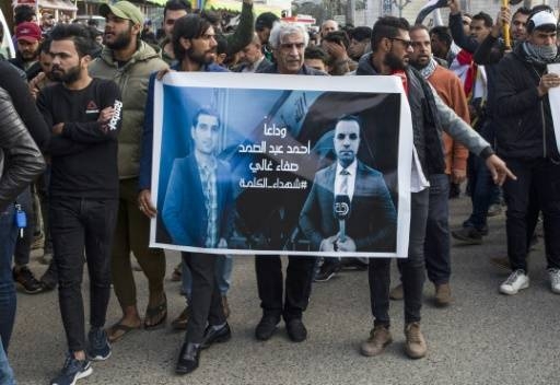 Iraqis take part in a rally commemorating Al-Dijla reporter Ahmad Abdessamad, 37, and his cameraman, gunned down in the southern city of Basra on Jan. 10. — File photo