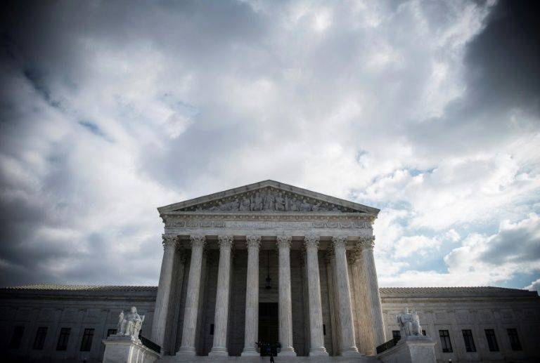 The Supreme Court's five conservative justices voted to support a request by President Donald Trump's administration to lift an injunction blocking a proposed immigrant welfare benefits rule. — AFP