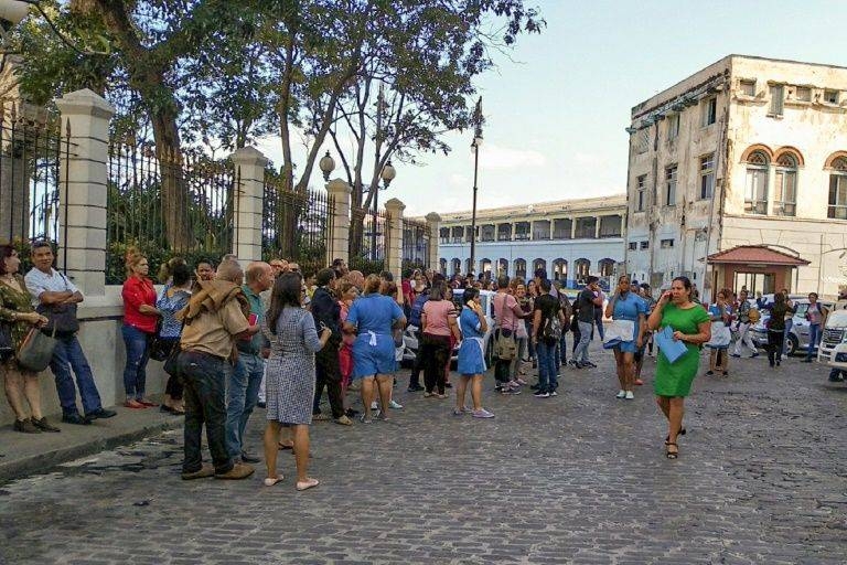 Workers leave their building after a 7.7-magnitude quake, which struck northwest of Jamaica, was felt in Havana, Cuba, on Tuesday. — AFP