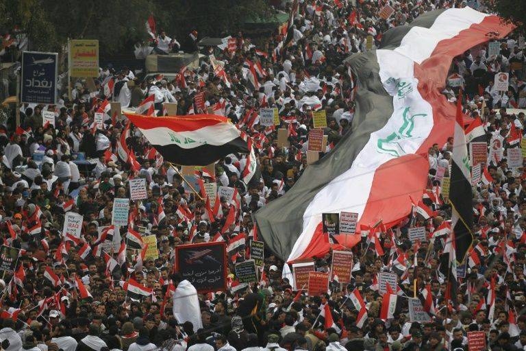 Thousands of Iraqi men, women and children of all ages massed in Baghdad to demand US troops leave the country. — AFP