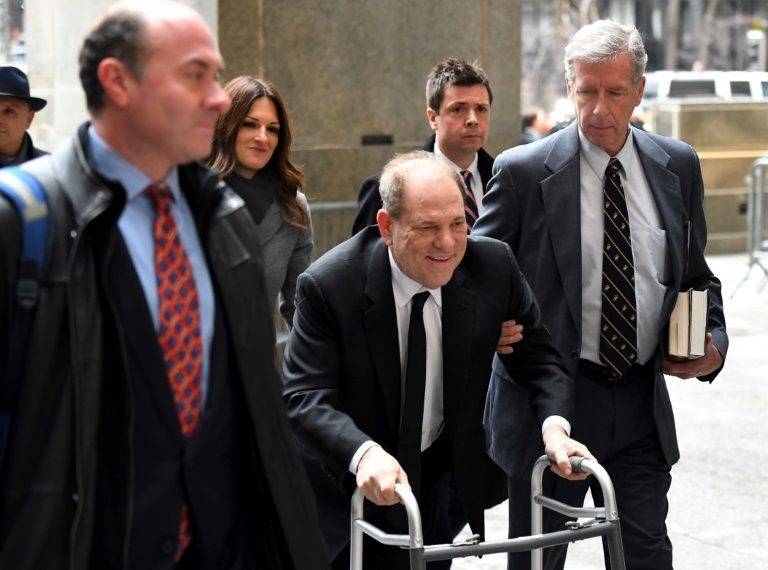 Harvey Weinstein, center, arrives using a walker at the Manhattan Criminal Court in New York in this file photo — AFP