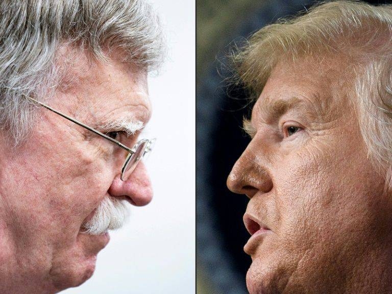 US President Donald Trump, right, and former National Security Adviser John Bolton, left, are seen in this file combination picture. — AFP 