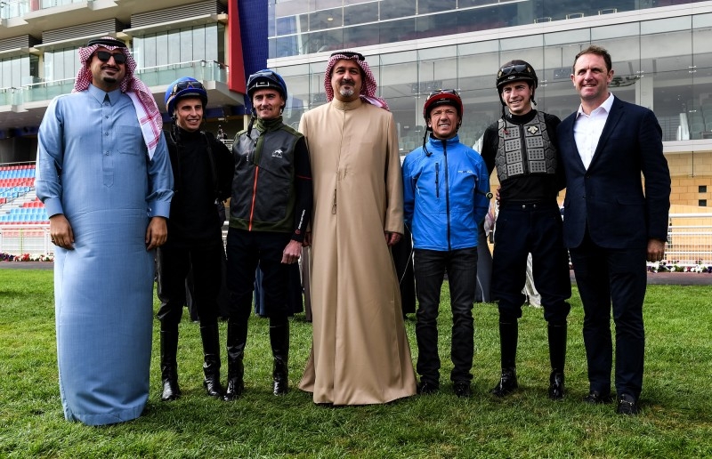 Prince Bandar Bin Khalid Al Faisal, chairman of the Jockey Club of Saudi Arabia, with jockeys ahead of the Turf Trial in Riyadh.