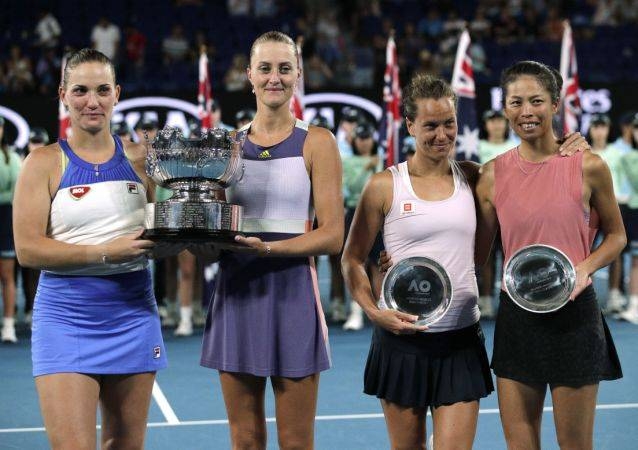 France's Kristina Mladenovic and Timea Babos of Hungary upset top seeds Hsieh Su-wei and Barbora Strycova to win their second Australian Open women's doubles title in three years on Friday.