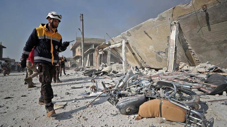 Members of the Syrian Civil Defense, also known as the White Helmets, inspect the scene following a reported Russian airstrike in the town of Saraqeb in the northwestern Idlib province. — Courtesy photo