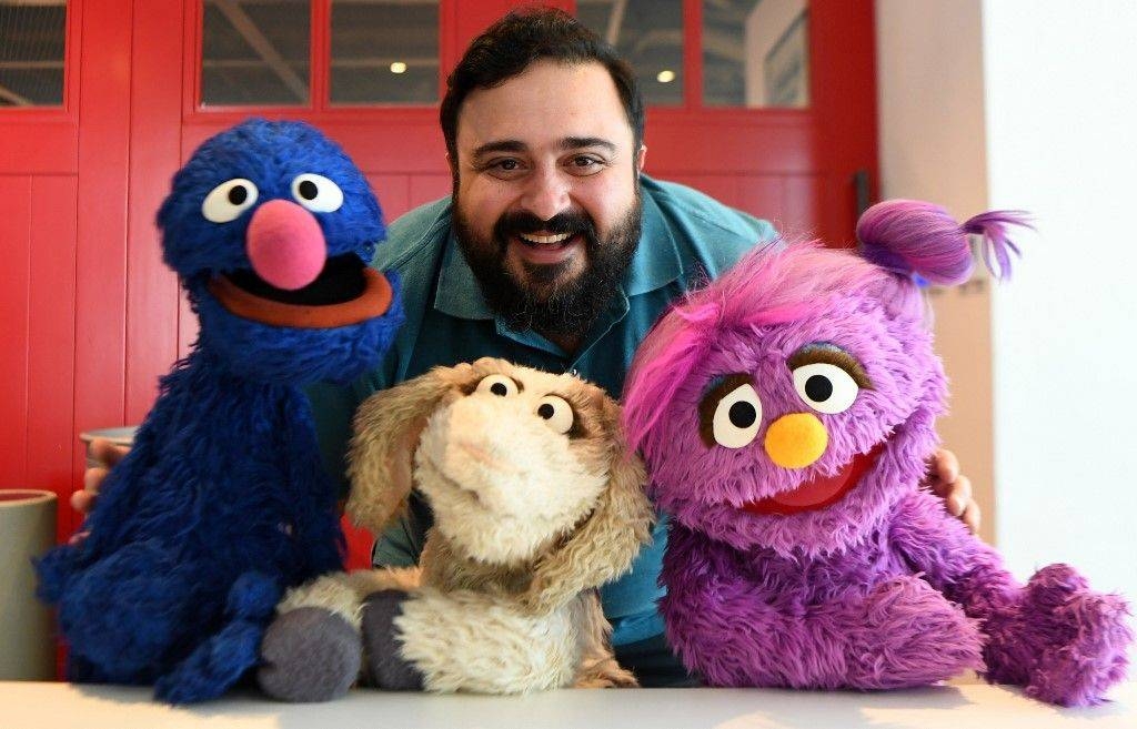 Hadi, the name of the character portrayed by a Jordanian actor Rami Delshad, poses for a picture with Grover (Gargur in Arabic), left, Ma’zooza, center, and Basma, right, from the Sesame Street television series, in Dubai, in this Jan. 28, 2020 file photo. — AFP