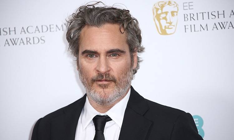 Actor Joaquin Phoenix poses for photographers upon arrival at the Bafta Nominees Party. — Courtesy photo