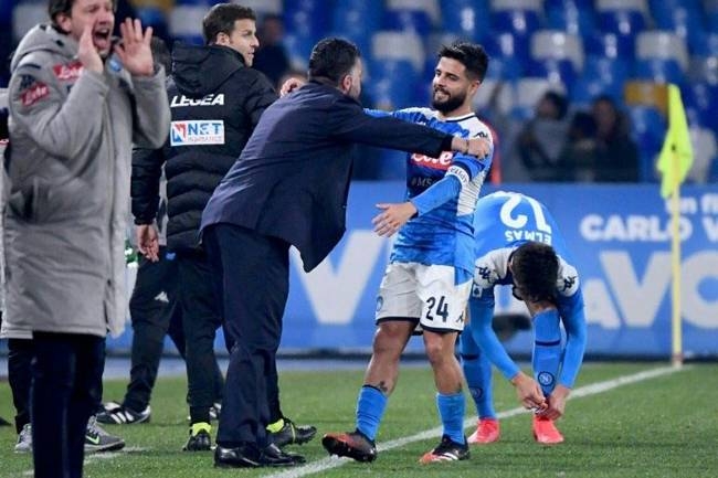 Napoli captain Lorenzo Insigne celebrates with coach Gennaro Gattuso. — AFP