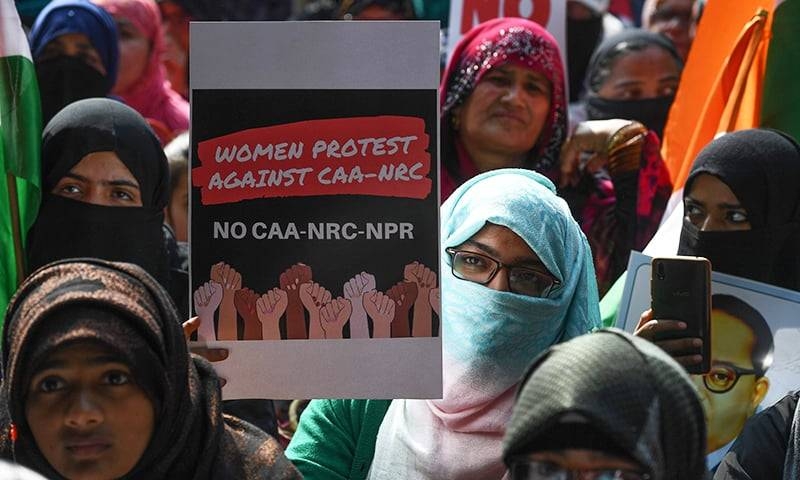 Protesters hold placards as they take part in a demonstration against India’s new citizenship law in New Delhi in this file photo. — AFP