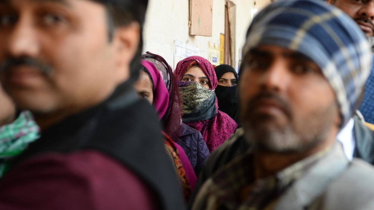 Long lines formed outside New Delhi polling stations amid heavy security as a weeks-old protest by women against a new citizenship law continued to cause chaos for commuters. — AFP