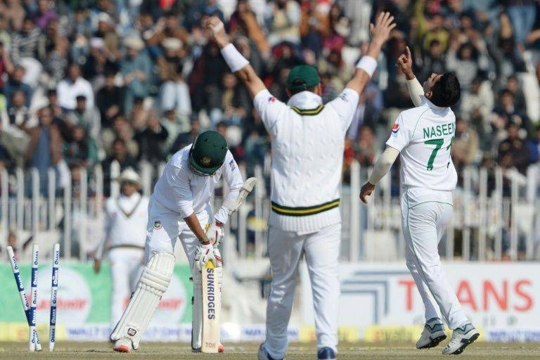 Pakistan bowler Naseem Shah points to the sky after taking the wicket of Bangladesh's Saif Hassan in Rawalpindi, Pakistan, on Sunday. — AFP 