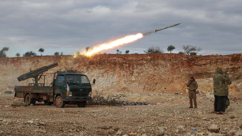 Syrian rebel fighters fire a rocket in northwestern Syria where battles with government forces have intensified in recent weeks. — Courtesy photo