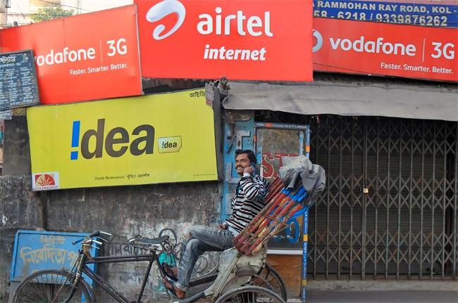 File photo of hoardings advertising the telecom services.