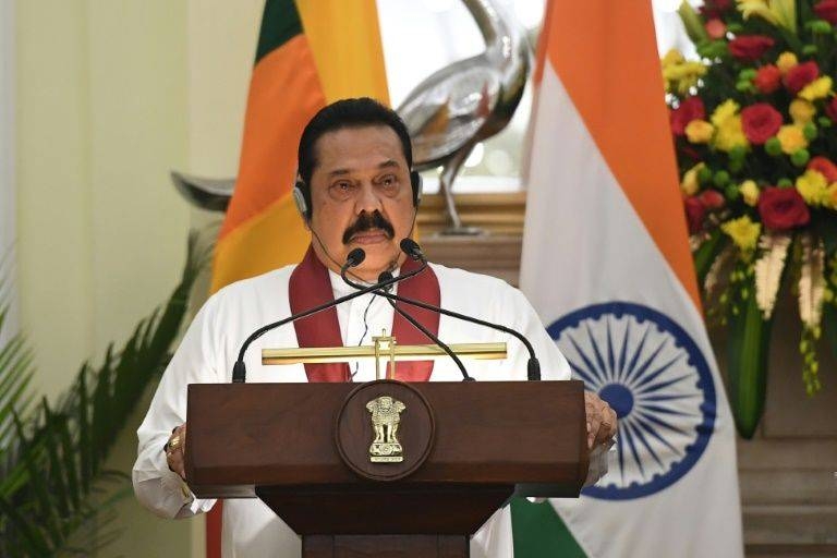 Sri Lanka Prime Minister Mahinda Rajapaksa said the country was withdrawing from a United Nations resolution to investigate war crimes. — AFP