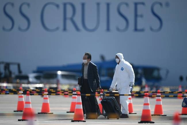 There are worries over allowing former Diamond Princess passengers to roam freely around Japan's notoriously crowded cities, even if they have tested negative for the coronavirus. — AFP