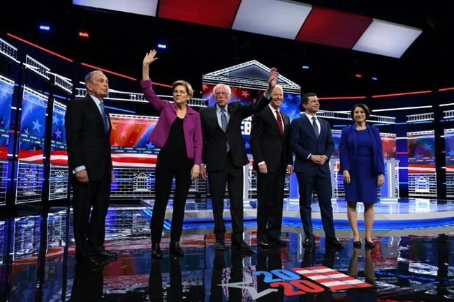 US presidential hopeful Mike Bloomberg (L), the former mayor of New York, joined his fellow Democrats on stage for the first time for their ninth debate of the party's nomination process on Wednesday. — AFP