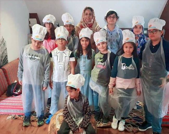 Group photo of little chefs with the nutritionist and expert Addiya Wahaj at the 
