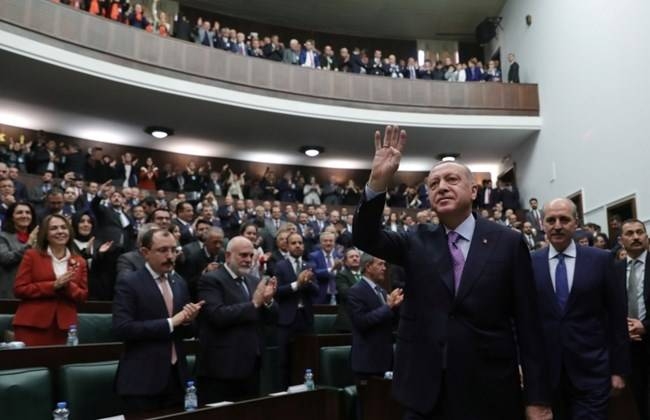 Turkish President Tayyip Erdogan greets members of his ruling AK Party during a meeting at the Parliament in Ankara, Wednesday. — Courtesy photo