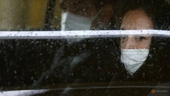 Iranians are wearing protective masks to prevent contracting Coronavirus, as they sit in taxi in Tehran, Tuesday. — Courtesy photo