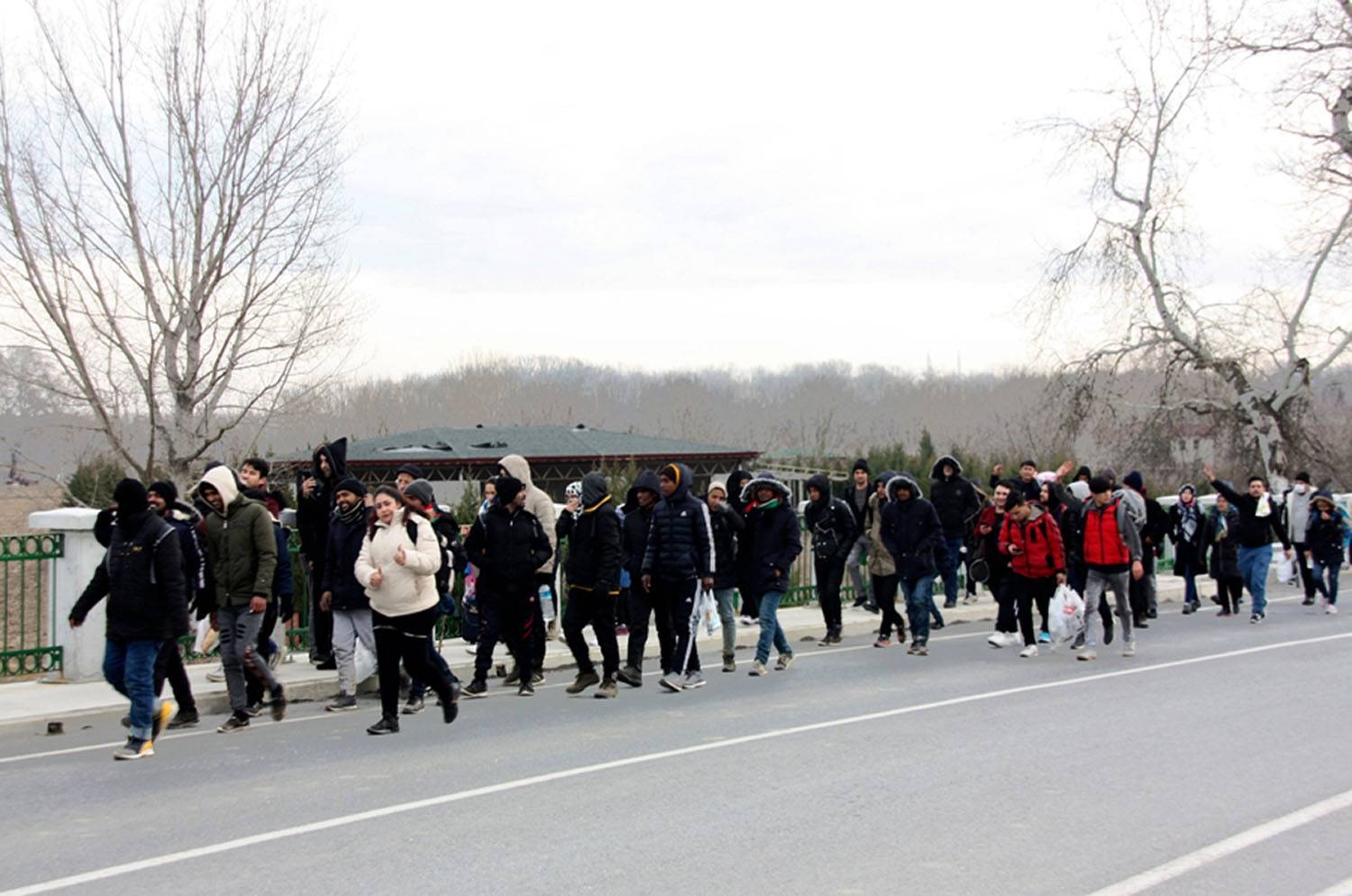 Migrants walk to the border gate of Pazarkule in Edirne, near the Turkey-Greece border, Greece, on Friday. — Courtesy photo