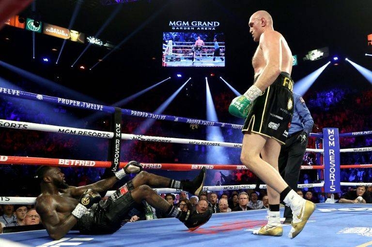 Deontay Wilder, left, says he is keeping trainer Mark Breland in his corner as he targets a rematch with Tyson Fury. — AFP