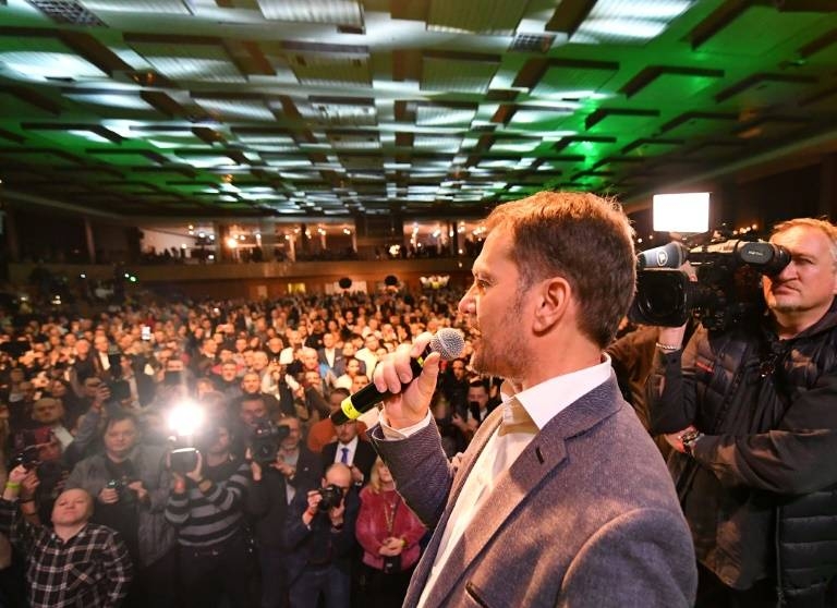 OLaNO party leader Igor Matovic speaks to supporters on his way to a resounding election victory. — AFP